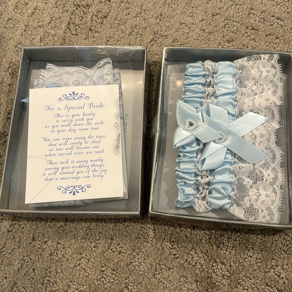 Brand new in separate boxes. 2 garters and one hanky for the Bride-to-Be